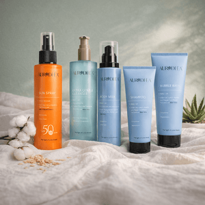 Aurodhea baby bath ritual set featuring sun spray, gentle cleanser, body milk, shampoo, and bubble bath on a neutral background.